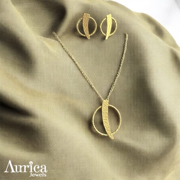 The Golden Orbit Metallic Pendant exudes modern sophistication with its sleek geometric design and radiant golden finish.