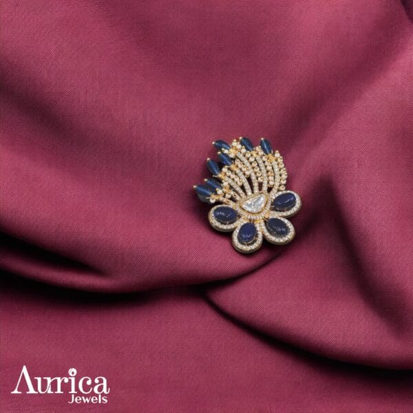 The Majestic Peacock Polki Ring draws inspiration from the enchanting grace of a peacock, symbolizing beauty, pride, and sophistication. CZ Diamonds, polki stones and blue colour stones