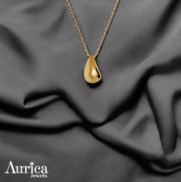 The Golden Teardrop Metallic Pendant is a flawless blend of elegance and simplicity, crafted to enhance your timeless style.