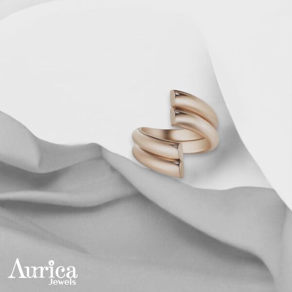 The Modern Spiral Ring captivates with its minimalist yet bold metallic design, perfect for those who embrace timeless elegance.