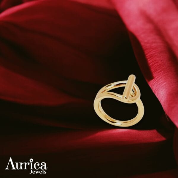The Loop of Elegance Ring redefines minimalism through its innovative metallic design and captivating geometry.